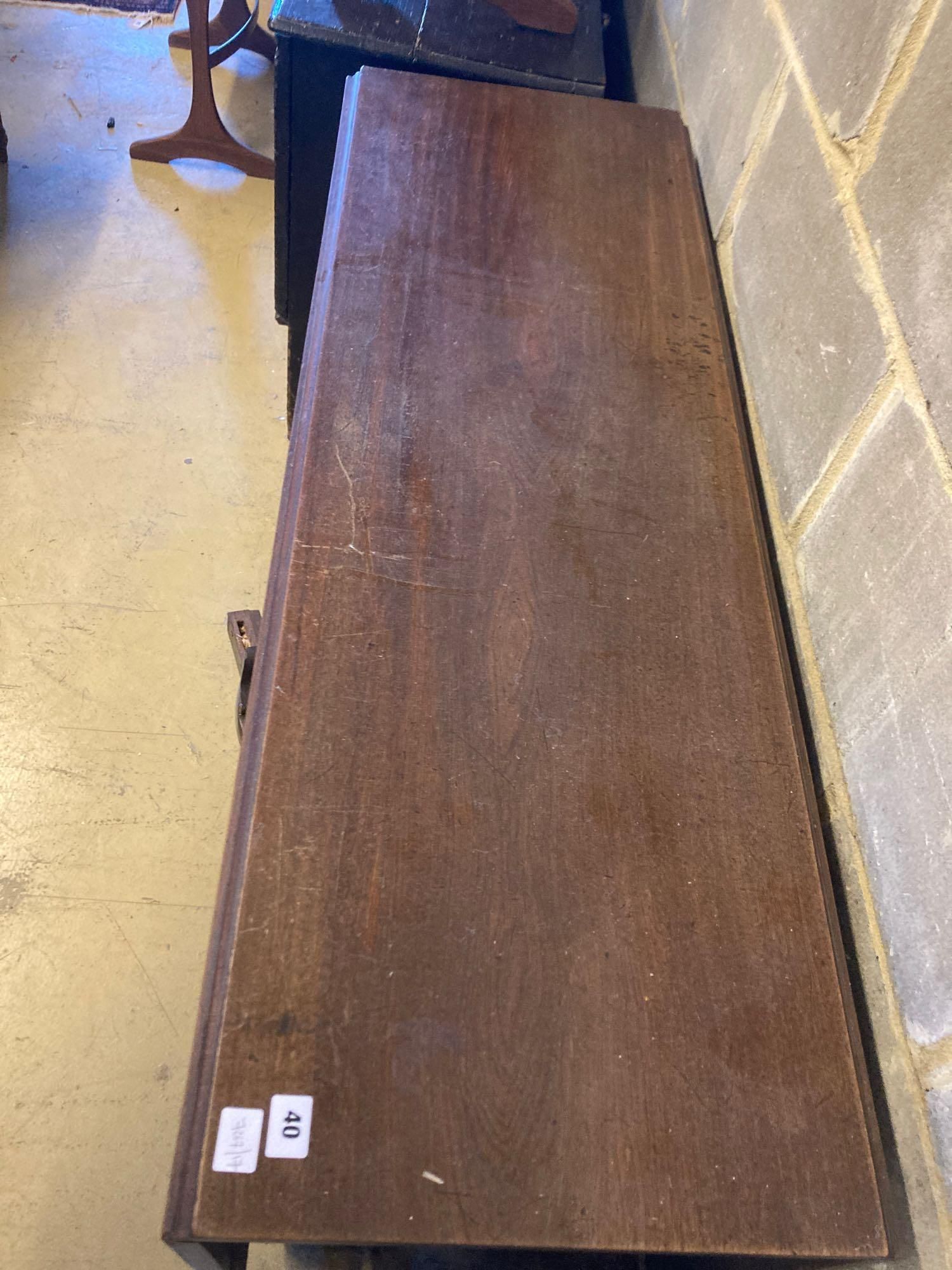 A George III mahogany drop-leaf dining table, with cabriole legs and claw and ball feet, length 122cm